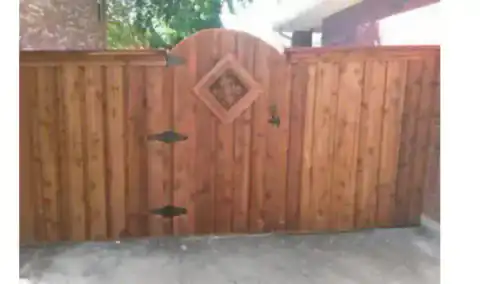 Aerial view of a cedar fence enclosing a residential yard.