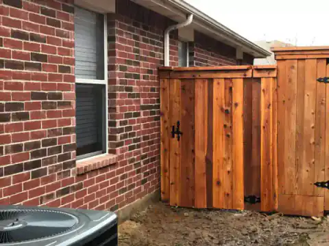 Aerial view of a cedar privacy fence around a backyard.