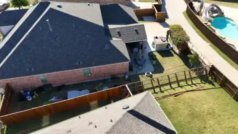 Aerial view shows cedar fencing around a North Texas home.