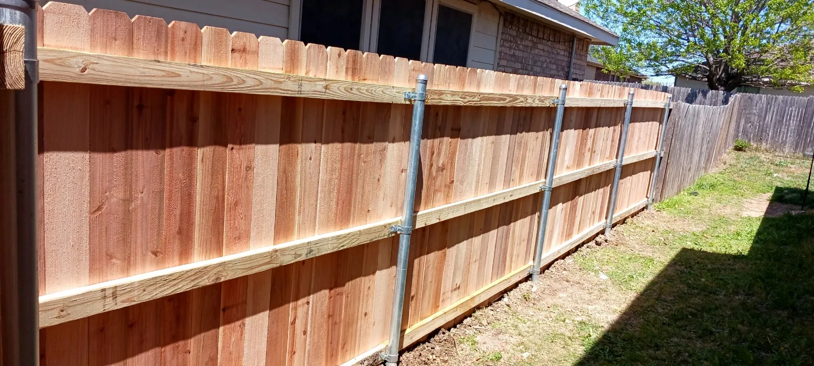Cedar privacy fence and patio area